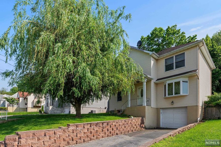 A Beautiful, warm, and inviting colonial located on a quiet street in Woodland Park. This spacious home offers 4 bedrooms, 4 full-bathrooms, & hardwood floors throughout. The first floor features an open floor plan, living room/dining room combination, a bedroom, full bathroom, and a huge updated Eat-In kitchen with stainless steel appliances. Sliding glass doors off of the kitchen lead to a level private backyard. 2nd floor presents a deluxe Master Bedroom with en-suite full bathroom, 2 large bedrooms and a full bathroom. The finished basement has another full bathroom and is the ideal hang out space for a playroom or home office. Excellent location w/ NYC bus within walking distance as well as local businesses, shops, & restaurants just minutes away! Ideal opportunity for NYC commuters. Convenient to highways, restaurants and everything Woodland Park has to offer. Easily accessible to buses and trains.