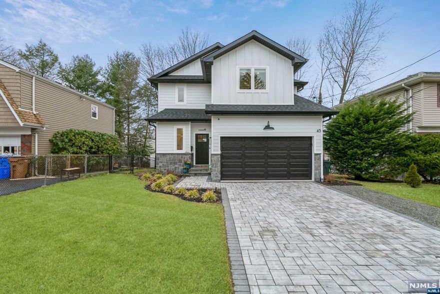 Newly constructed Colonial offers 5 bedrooms, 3 1/2 bathrooms, & attached 2-car garage on quiet, tree-lined street. This luxurious home showcases a stone paver driveway and walkway guide you inside to a 2 story foyer w/ powder room and a stunning quarter-turn staircase, an open concept interior encompassing the living room, dining room, & a sleek eat-in kitchen equipped with granite counters, S.S appliances, and a center island with seating, perfect for entertaining. Sliding glass doors in the living room open to an inviting patio & manicured back yard. Upstairs, primary bedroom suite complete walk-in closet, & private bathroom with a dual-sink vanity, along with three additional bedrooms and a full hallway bathroom. The finished basement includes large recreation room, 5th bedroom, a full bathroom, & ample storage space. Home is ideally located within a mile of schools, close to a bustling downtown, & less than ten minutes from the GWB! Owner holds a real estate license.