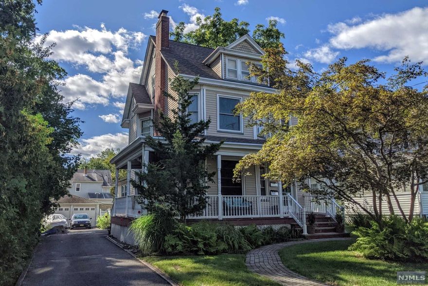 INVESTMENT OPPORTUNITY! Long term tenants (14 and 20 years). 2-family, top/bottom Victorian in prime Hawthorne location on a tree-lined residential street close to Goffle Brook Park, town, train, shops, Rt. 208, schools and more. Picturesque curb appeal accentuated by newer composite lemonade porch, vinyl siding, vinyl windows, specimen plantings, new vinyl fence and oversized detached garage with workshop/shed. First floor unit features living room with fireplace, dining room, updated kitchen with yard access, two bedrooms and a full bath. The second floor unit enjoys a kitchen, family room, bar, bedroom and bath with stairs to a finished attic bedroom/office and storage. Both units can access full, unfinished basement with laundry, utilities, storage and throne room (toilet). Buy as an investment or live in one unit while collecting rent. Must view virtual tour before a showing.