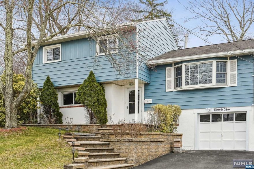 Welcome Home to this Beautiful 4 Bedroom 2.5 Bath Split Level Home!! You'll Love the Open Sunlit Floor-plan with Updated Kitchen, Gorgeous Hardwood Floors, and Convenient Dining Room that Opens to a Spacious Maintenance Free Deck that's Perfect for Entertaining. Don't Forget the Large Bedrooms Including the Primary with it's own En-Suite Bath. Additional Features Include the Lower Level Family Room and an Oversized Attached Garage. Close Proximity to Schools, Parks, Highways, Restaurants & the Rockaway Mall.