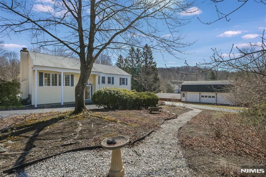 *****Attention landscapers, contractors, car collectors, etc... LARGE barn/outbuilding with 10 garage bays formerly used as a woodworking shop and antique cars storage. Original owner built the single-family home and features updated kitchen & baths, vaulted great room off the dining room overlooking a large rear yard. Beautiful hardwood floors, updated windows, maintenance free siding & freshly painted T/O are just some of the amenities. 4 zone updated boiler, water softener system & central air. Primary bedroom has dual entry to main bath. Lower-level features family room with woodburning brick fireplace, office with built-ins, laundry room & updated full bath. Circular drive and rear driveway with parking for approximately 4 cars & 1 car attached garage. True Pride of ownership from an original owner.