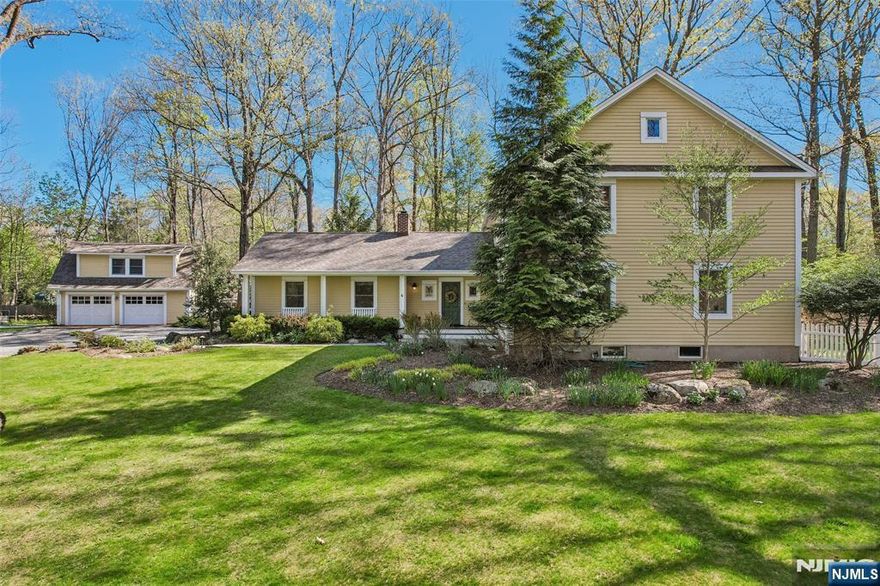 FARMHOUSE COLONIAL SET ON OVER AN ACRE OF PRIVATE PROPERTY TUCKED ON A QUIET CUL DE SAC WITHIN CLOSE PROXIMITY TO ALL SCHOOLS, LIBRARY & CRESTWOOD LAKE. THIS HOME BLENDS TIMELESS CHARACTER W/ PEACEFUL, BEAUTIFULLY CURATED INTERIOR. SOFT TONES THROUGHOUT THE HOME, DETAILED MOULDINGS, & CUSTOM BUILT-INS CREATE A WARM & INVITING ATMOSPHERE, WHILE ABUNDANT WINDOWS FILL THE HOME WITH NATURAL LIGHT. MAIN FLOOR OFFERS GRACIOUS ENTRY FOYER,COUNTRY KITCHEN W/ BREAKFAST AREA, WALK-IN PANTRY, MOVABLE BUTCHER BLOCK ISLAND, FDR, FLR, COZY FRONT TO BACK GRT RM W/ BUILT-INS & WOODBURN FPL, BR W/ ENSUITE FBA, BR, FBA, LAUNDRY RM, MUD RM W/ PR, & ACCESS OFF KIT & MUDRM TO BLUE STONE & BRICK PATIO. 2ND FL OFFERS 2 BR, FBA W/ DOUBLE VANITY, OFFICE/NURSERY, PRIVATE MBR SUITE W/ SPA-LIKE MBA & WALK-IN CLOSET. FINISHED LOWER LEVEL OFFERS REC RM, FUTURE GYM AREA, STORAGE & O/E. DETACHED 2 CAR GARAGE W/ LOFT - INCL WET BAR. BASKETBALL COURT. WHOLE HOUSE GENERATOR. CENTRAL VAC. PRIVACY, TRANQUILITY, CASUAL ELEGANCE, CHARM, BEAUTIFULLY & LOVINGLY MAINTAINED, PERFECTLY SITUATED!