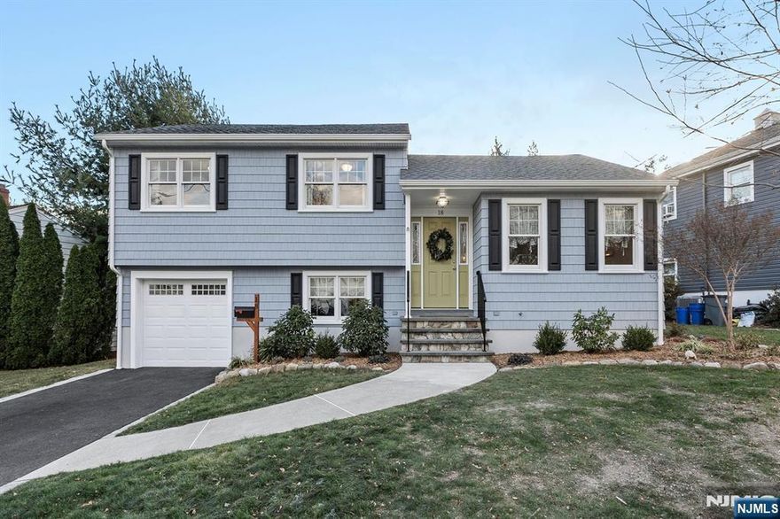 Welcome to this beautifully updated split-level home in Bloomfield, NJ! Move-in ready, it features a bright living room leading to a modern kitchen with a center island and stainless steel appliances, perfect for entertaining. The ground level offers a laundry room, half bath, family room, and access to the attached garage. Upstairs are three spacious bedrooms, including a primary suite with a private bathroom, plus a second full bath. The fully finished basement adds versatile living space with built-in cabinetry, a workspace, and ample storage. Enjoy the oversized backyard and patio for outdoor activities. Key updates include a new roof (2023), central air (2018), Anderson windows/doors (2018), Hardie plank siding, and a finished basement (2021). Additional features: newer water tank, boiler, fresh paint, and new interior doors. Donâ€™t miss this gemâ€”your dream home awaits!