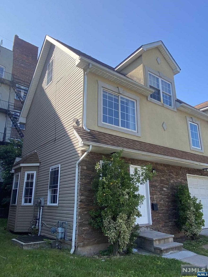 Beautiful, fully-renovated semi-detached home. Four bedrooms, 2.5 bathrooms. Features 4 levels of finished space, garage + driveway, central heating and cooling. Updated top to bottom: new kitchen and bathrooms, refinished floors, freshly painted. Easy access to GS Parkway, 280, East Orange train station.