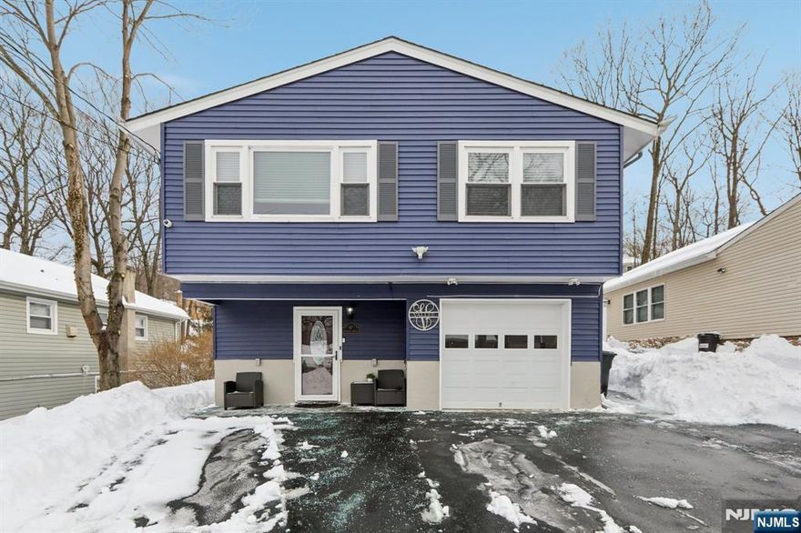 Renovated, Modern, and Move-In Ready. Beautifully updated 4BR, 2BA raised ranch offering approximately 1,800 sq ft in White Meadow Lake. The ground level opens with an oversized entry foyer and generous closets, leading to a large rec room, a renovated full bath with hinged glass that converts the shower into a steam-shower, and a private first bedroom ideal for guests or a home office. Upstairs, the remodeled kitchen flows seamlessly into the dining and living areas, creating an open, bright layout perfect for everyday living. Three additional bedrooms and a second updated full bath complete the upper level. Major improvements include gas conversion, plumbing updates, flooring, newer windows, newer roof, newer central AC, irrigation system, security system, and a freshly paved and expansive driveway accommodating up to five or more cars. Sliding doors lead to an open, continuous covered paver patio that begins at the rear sliders and steps up to an elevated section, all protected under a full roof. This year-round outdoor living space overlooks a usable backyard extending to a finished shed/gym with mini-split HVAC, mirrored, and flexible use as a studio, office, or fitness room. Public sewer and access to White Meadow Lake's beaches, boating, clubhouse, and year-round activities make this a rare turnkey opportunity in a highly desirable community. Too much to list! Ask for highlights list.