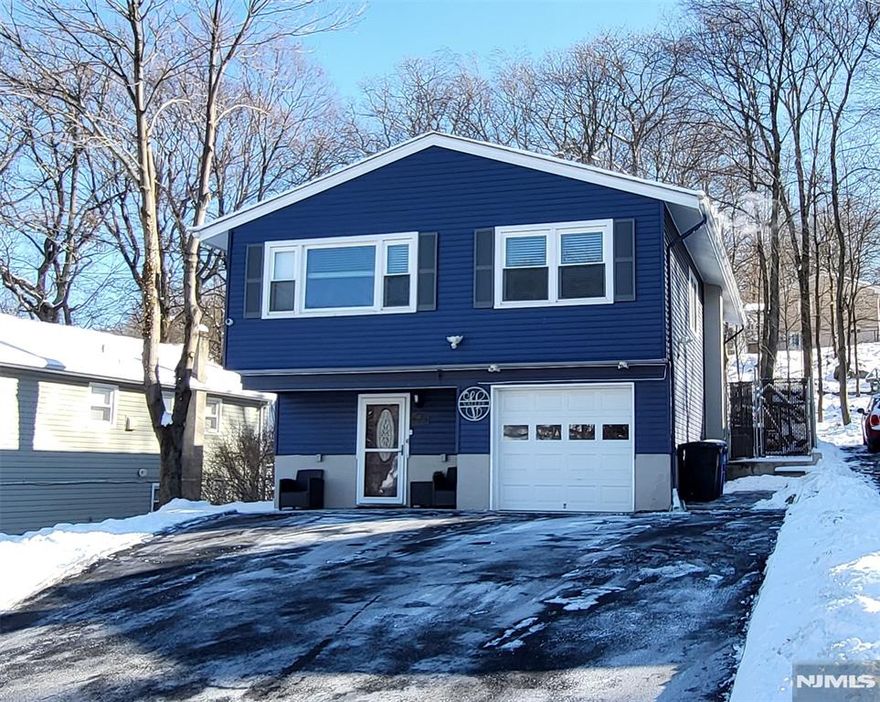 Coming Soon, 1/27! Renovated, Modern, and Move-In Ready. Beautifully updated 4BR, 2BA raised ranch offering approximately 1,800 sq ft in White Meadow Lake. The ground level opens with an oversized entry foyer and generous closets, leading to a large rec room, a renovated full bath with hinged glass that converts the shower into a steam-shower, and a private first bedroom ideal for guests or a home office. Upstairs, the remodeled kitchen flows seamlessly into the dining and living areas, creating an open, bright layout perfect for everyday living. Three additional bedrooms and a second updated full bath complete the upper level. Major improvements include gas conversion, plumbing updates, flooring, newer windows, newer roof, newer central AC, irrigation system, security system, and a freshly paved and expansive driveway accommodating up to five or more cars. Sliding doors lead to an open, continuous covered paver patio that begins at the rear sliders and steps up to an elevated section, all protected under a full roof. This year-round outdoor living space overlooks a usable backyard extending to a finished shed/gym with mini-split HVAC, mirrored, and flexible use as a studio, office, or fitness room. Public sewer and access to White Meadow Lake's beaches, boating, clubhouse, and year-round activities make this a rare turnkey opportunity in a highly desirable community