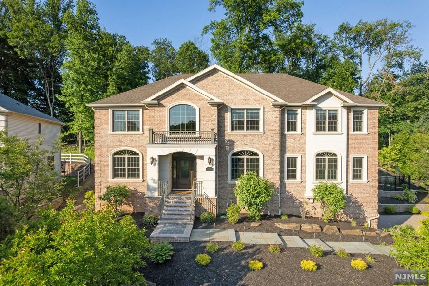 The Reserve at Bel Air welcomes you to STUNNING model estate w every imaginable lux detail, nestled on a resort-like half acre property just a 30 minute train ride to Midtown NYC. This spectacularly modern + sunny home is nestled on a private 1/2 acre lot corner + offers a complete turn-key lifestyle. 1 Wadams features a grand 2 story entry foyer, OFP w a bright white designer kitchen, elevator to 3 levels of luxury living, a primary suite w sitting rm + coffee bar, guest suite w full bathroom, + office on 1st level overlooking a gorgeous yard w custom in-ground pool + outdoor kitchen. LL is FULLY finished w high-end wine cellar + exercise rm + kitchen & full bath perfect for guests, multigen living, +/or a nanny suite. Near Jitney to direct NYC train + community park + + the vibrant downtowns of Montclair, Maplewood & South Orange which border WO for dining, cafes, shops, art, bars, culture + museums. Back your bags + move right in!