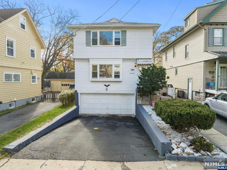 Location, location, location! Prime Montclair multi-family home ideal owner occupied w/rental or investment home is minutes from both Upper Montclair and Bloomfield Ave, restaurants and NYC Midtown Train and Montclair High. Beautifully maintained 2 family w/walkout basement. Spacious rooms in each unit incl: 3 BR, large LR , DR, EIK & BA. Gleaming hardwood floors, updated kitchen and bathroom on second floor,brand new windows, huge backyard and deck to enjoy with family and loved ones. Terrific live in/rent options w/sep front entrances, fenced yard, interior staircase from side yard to all units plus sep utilities, bsmt laundry hooks-up for 2 W/D & storage.New hot water tanks. Best of all, 2 car garage & 2 car off street driveway parking.