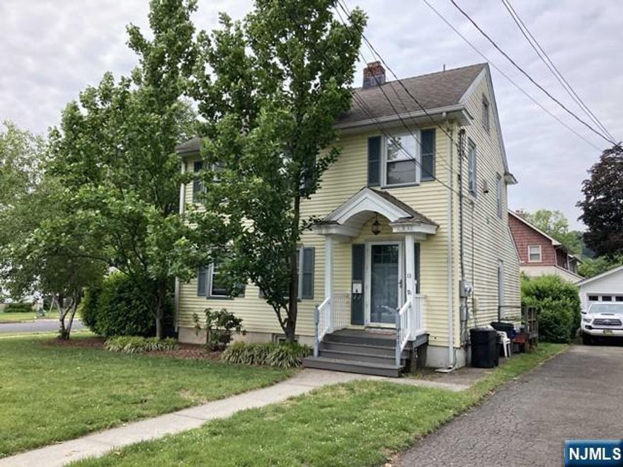 Beautiful Colonial style two family home on corner lot. This spacious first floor apartment features living room , den/sun room, modern eat-in-kitchen, bedroom and full tile bath. Full, unfinished basement, with laundry facilities. Spacious yard. Close to Town Center, Beautiful Goffle Brook County Park, Train Platform and Shopping.