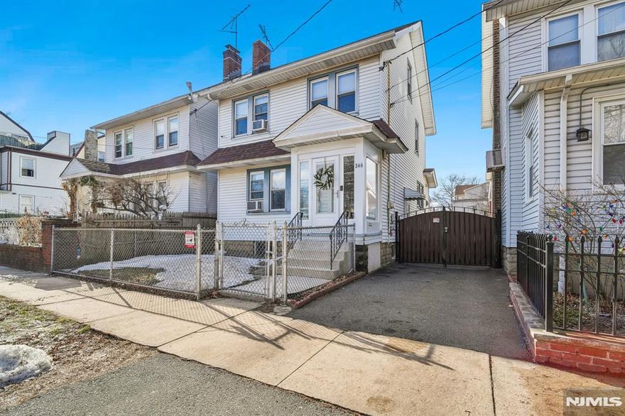 This classic Colonial offers exceptional value with versatile living, ample parking, and seamless commuter access all in one compelling opportunity. A sunny vestibule welcomes you into a warm interior featuring a living room with fireplace and a formal dining room designed for both everyday living and entertaining. The spacious kitchen offers abundant cabinetry and counter space for gatherings large or small. A bright breakfast nook or work-from-home space connects to the mudroom with access to the backyard.The main levels include three bedrooms and a full bath. The finished lower level adds flexibility with a private entrance, additional rooms, a full bath, and a small kitchen area ideal for extended living, guests, or home office use. A separate laundry room (hook-ups only) conveniently serves both levels. Outside, a gated driveway provides generous off-street parking, complemented by a detached two-car garage a rare amenity in this area. The fenced backyard offers privacy, space to entertain, or potential expansion. Located approximately 0.6 miles to the Newark Light Rail with connection to Newark Penn Station, and minutes from Route 280 and the Garden State Parkway, downtown Newark, and neighboring communities, this home delivers accessibility, green space, and long-term potential at a compelling value. An exceptional opportunity for first-time buyers, NYC commuters, or anyone seeking flexible living with strong upside.