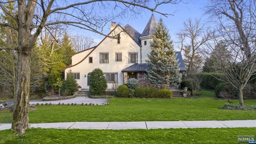 EXPERIENCE THIS ARCHITECTURAL MARVEL LOCATED IN RIDGEWOOD'S PRESTIGIOUS OLD COUNTRY CLUB. FROM ITS LEADED LATTICED WINDOWS TO COFFERED CEILINGS & INTRICATE MILLWORK, EVERY DETAIL EXUDES ELEGANCE. ENTER THRU THE GRAND FOYER W/ GAS FPL, LEADING TO A BRIGHT DR FEATURING FRENCH DRS OPENING TO A STONE-COVERED PATIO. THE SUNROOM W/ CAPTIVATING WOOD CEILING & EXPANSIVE WINDOWS, SEAMLESSLY CONNECTS INDOOR & OUTDOOR SPACES. THE 1ST FLOOR BOASTS PR & SPACIOUS KITCHEN W/ TOP-OF-THE-LINE APPLIANCES & FRENCH DRS TO DECK OVERLOOKING THE POOL & GROUNDS. LR W/ WOOD BURNING FPL & ARCHED DOORWAYS TO KITCHEN & DEN/OFFICE. HARDWOOD FLRS GRACE THE 2ND FLR OFFERING A PRIMARY BR W/ BALCONY,ENSUITE BTH & OFFICE ALONG W/ 3 ADD. BRS, FULL BTH & LAUNDRY. THE 3RD FLR HAS HALL BTH, TURRET ROOM & 2 ADD. BRS. THE LOWER LEVEL INCLUDES SAUNA/SHOWER RM, FAMILY RM, GYM & GARAGE ACCESS. THE MUDROOM/INDOOR CABANA HAS AMPLE STORAGE,.5 BTH & DIRECT POOL ACCESS. THIS METICULOUSLY MAINTAINED HOME AWAITS YOUR DISCOVERY!