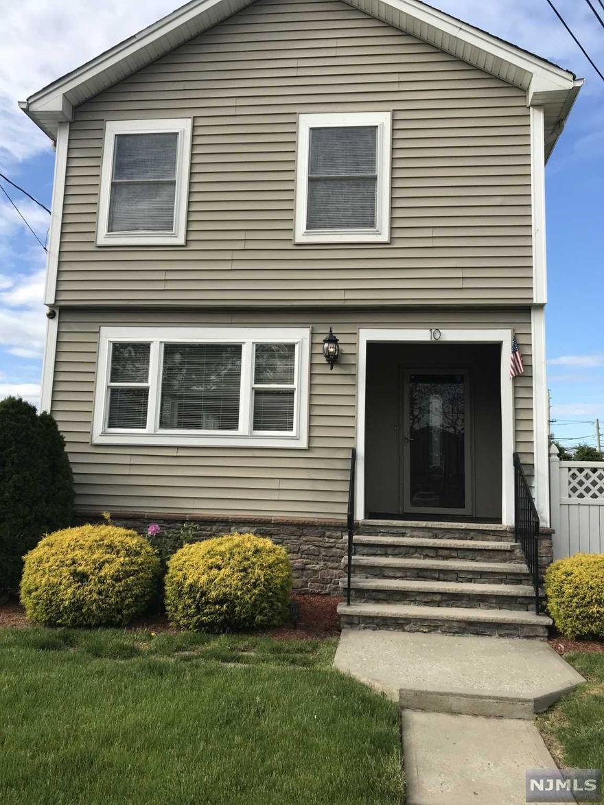 Updated colonial, granite kit w/center island. Open floor plan with loads of windows to let bright light in. 1/2 Bath on 1st floor. On 2nd floor are primary bedroom with cathedral ceiling, large closet and full bath with new vanity and tile floor. 2 additional bedrooms and full bath. Walk-up stairs to finished 3rd floor room with new flooring. Basement w/french drain. Hardwood floors throughout, central A/C. Access to rear fenced in yard from kitchen. This is a beautiful home close to park, NY trans and shops. Don't miss this one!! Listing agents related to seller.