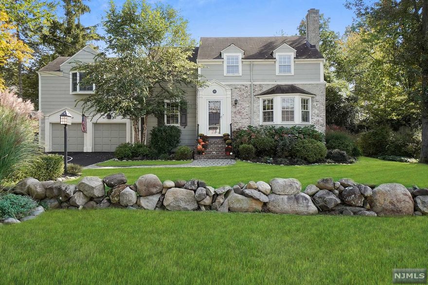 Fall in love with 69 Sunset! Spectacular curb appeal & pretty landscaping welcome you to this updated colonial! Hardwood floors, living room w gas fireplace, formal dining room, updated eat-in kitchen w stainless appliances, granite counters, wine fridge, double ovens, and a separate dining area. The kitchen opens to a spacious family room with French doors to the lush, green backyard w/ oversized deck and charming storage shed. First-floor room for office/den/guest room! Large primary suite with two walk-in closets & an en-suite w jetted tub & stall shower. This home will check all your boxes - first-floor powder room, 2nd-floor laundry, a finished basement w another powder room, 2-zone C/A, 2-car attached garage with an electric car charger & a generator hook up, underground sprinklers, surround sound speakers, nest thermostats, alarm system & new driveway to boot! NYC transportation at the end of the street, and short distance to Blue ribbon Brookdale School. Welcome Home!