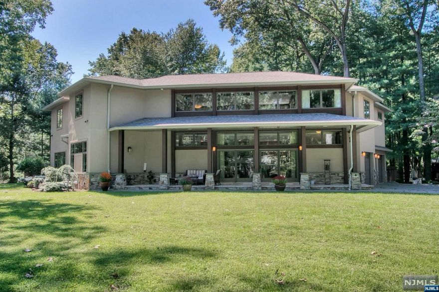 A CUSTOM MASTERPIECE. This spacious home located in one of the most desirable sections of Demarest offers easy, luxury, resort living and features 5 BRs, 5 Full and 1 Half BA with 2nd floor office. The home offers an abundance of natural light from the floor-to-ceiling windows on the first floor that makes this open floor plan breathtaking. The gourmet chef's kitchen features stainless steel appliances, radiant heated flooring, a center island & ample storage with a large, open dining room great for hosting. The private oasis-like backyard features stainless steel appliances, a salt water heated pool and jacuzzi and ample seating on the large patio perfect for entertaining. Soaring ceiling heights, large bedrooms, finished lower level w/ a second family room, and radiant heated bathrooms are just a few of the many features this home has to offer. Demarest offers blue ribbon schools, great shopping, dining, and only 15 min from The GW Bridge.