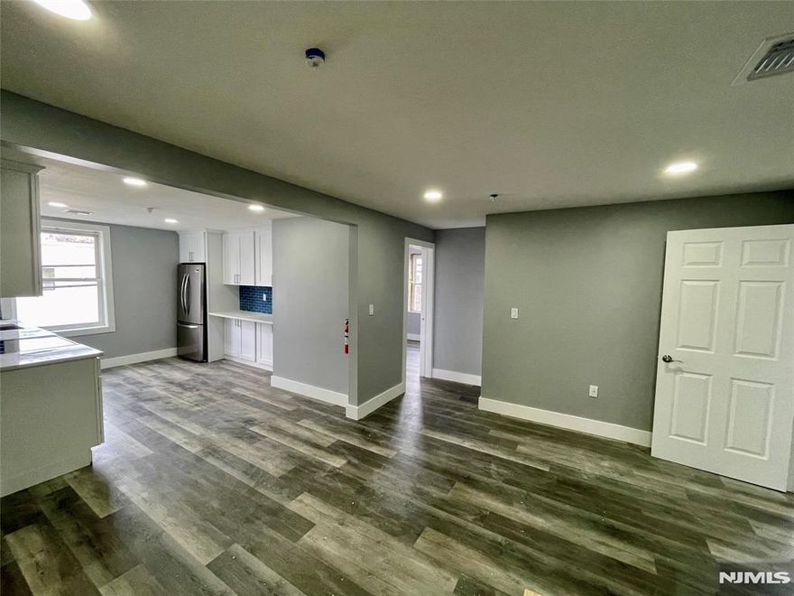 Modern and completely updated 3 bedroom, 1 bath apartment now available for rent! This renovated, open concept apartment is on the second floor of a mixed use building with a super convenient location directly across from the Town Centre Shopping Center and only 1 block from the new Lyndhurst Train Station, Township of Lyndhurst's Recreation Complex, Park and Amphitheater! Apartment features a gorgeous eat-in kitchen with brand new quartz counters, mosaic tile backsplash, stainless steel appliances (including a built-in microwave and dishwasher), a breakfast bar, plenty of cabinets and a pantry. The living room is bright and airy. There are 3 bedrooms, one with a walk-in closet. The renovated bathroom features a double vanity sink and nice size linen closet. Other highlights include: freshly painted, new laminate and tile flooring throughout, brand new central air and forced hot air system, new windows, LED lighting and USB outlets. Tenant pay utilities, no smoking of any kind, no pets of any breed. On street parking only.