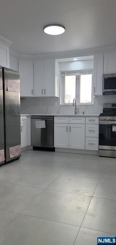 Photo of 227 2nd St #2, Palisades Park, NJ 07650 (MLS # 25041510)
