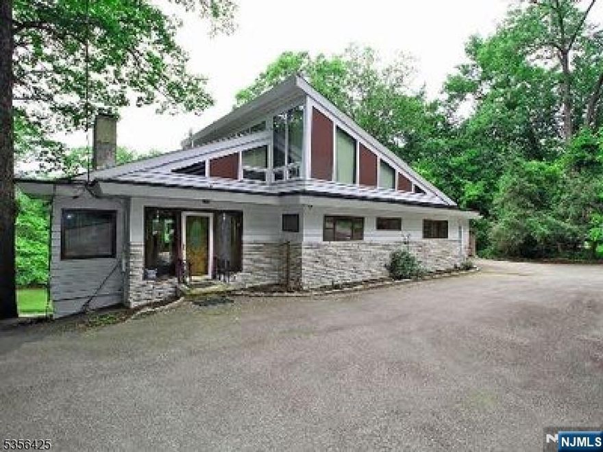 Private lakefront property with lake views from virtually all rooms. Versatile floor plan suited for work from home lifestyle and flexibility of guest quarters on lower level. Updated kitchen & baths 2018, Newer (2024) patio, driveway, parking area, finished basement. Easy location minutes from major highways a 30-minute drive from Newark Airport and close to New York City with convenient Park & Ride options at Wayne Transit Center and Willow brook Mall. Sold as is other than environmental and major structural.