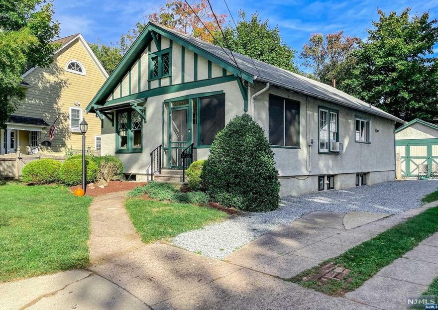 Enchanting Light & bright cottage nestled in a quiet cul-de-sac setting in the heart of Ridgewood, just 2 blocks from train station, Whole Foods, & a variety of boutiques, shops, restaurants. Close to elementary & middle schools. Glass French Door separates screened front porch from cozy LR w/fpl. HW floors throughout main level, except for kit. & bth. Plenty of windows for natural light. Renovated bth has jetted tub. Modern kit. with vaulted ceiling leads to open hall w/door to patio. The finished LL is bright w/plenty of windows, recessed lights & has Fam Rm., large guest rm, office, lndry & room for another bath. Lovely backyard w/newer paver patio, a cozy side yard w/2nd patio, detached 1-car gar. Back yard wired for pet fence. HW heater is brand new (7/2022), furnace new in 2017, all LL windows replaced in 2012. Nothing to do but unpack your bags! Sale contingent on owner finding another home. Actively looking.