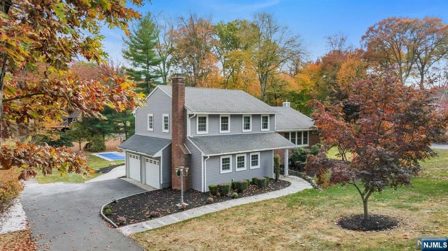 Welcome to 756 Mountain Ave-a residence where fabulous outdoor spaces match a beautifully refined interior. Completely renovated in 2016, this sugar maple split-level has been transformed into a luxurious retreat. The entry foyer, with a bench for storage, leads to a cozy family room adorned with crown molding, a wood-burning fireplace, and closet. This level also includes a full bath. Upstairs, discover custom raised panel woodwork, gleaming HW floors, and crown molding in the formal living and dining rooms. The kitchen shines with a 6-foot island, a wine refrigerator, and new Thermador appliances. Three upstairs bedrooms feature custom closet organizers; the spacious primary suite includes a full bath with double vanity and walk-in shower, while the other 2 bedrooms share an updated full bath. The lower level offers a rec room, laundry, and storage. Outside, enjoy a 30x30' sports court for basketball, unwind with evening firepits, and grill great meals. Great Sicomac location!