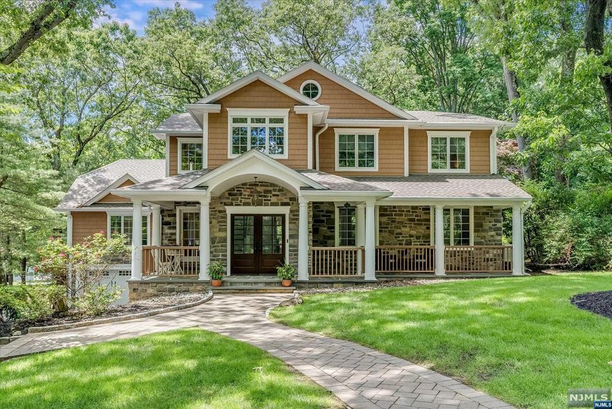 Step inside this sun-filled home, which once belonged to Yankee Great Yogi Berra. This exquisite home has been renovated & expanded to include an inviting wrap-around porch, multi-tiered deck, circular driveway & over 4000 sq.ft of luxurious living space. As you step inside, you'll find a soaring 2-story EF w/richly-hued hardwood flrs that seamlessly flow into the spacious great rm, dining rm, living rm w/fpl, & a gourmet eat-in kitchen w/high-end stainless appliances. This exceptional home has 5 BDRs (3 of which are en-suites). There are also 5-1/2 baths, 2 laundry rms, and 2 dedicated offices. A serene primary ste, w/sitting area & spa-like FBTH, is a blissful retreat. A fully-fin basement offers versatile space for work & entertaining, while modern updates, a newer roof, expansive walk-in closets, & 3-car garage add to the home's allure. Ideally situated to top-rated WCL schools, town amenities, & NYC transportation - this home is great, just like Yogi!