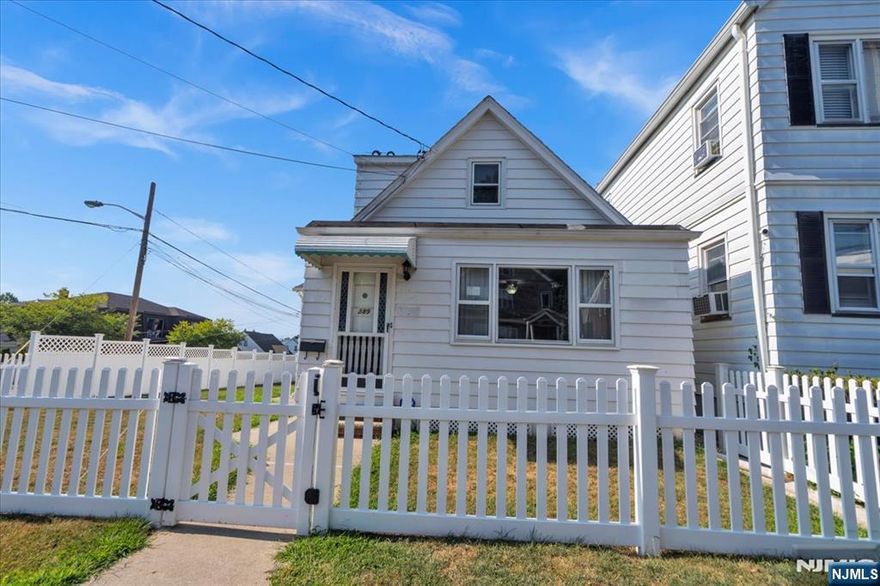 Located in one of the most desirable neighborhoods of Garfield, this charming 2-bedroom, 1.5-bath home features a finished basement with a family room + 2 rooms. The walk-up attic offers exciting potential to add even more living space. Brand-new central air system ensures year-round comfort. Very low taxes Outside, you'll find a 2-car garage with extra parking and a fully fenced backyard perfect for relaxing or entertaining. Just minutes from the Plauderville train station to New York City, schools, parks, and shopping, this home offers comfort, convenience, and room to grow.