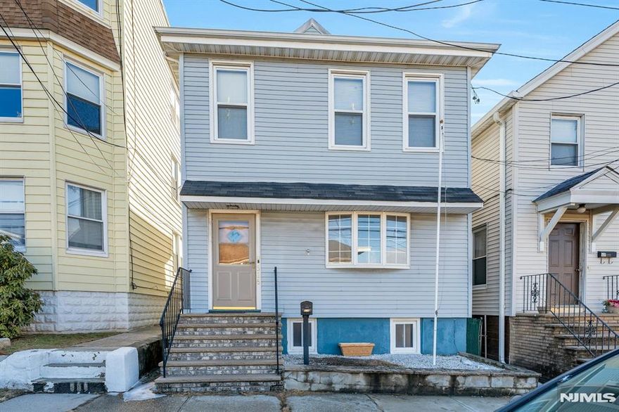 Arlington Section vinyl-sided updated 2-family, only 1 block to NJ Transit bus #40 to Harrison PATH! 1st floor has Living/dining room, kitchen, 1 bedroom and full bath, 2nd floor has Living room, kitchen, 2 bedrooms, full bath & walk-up attic to finished room. Full unfinished basement with laundry hookups. 1 gas steam radiator furnace, 1 hot water, 2 separate gas & electric meters. The 1st floor will be delivered vacant at closing. 2nd floor currently rented for $1,750 per month, on a month-to-month basis. Kitchens & baths were renovated a few years ago.