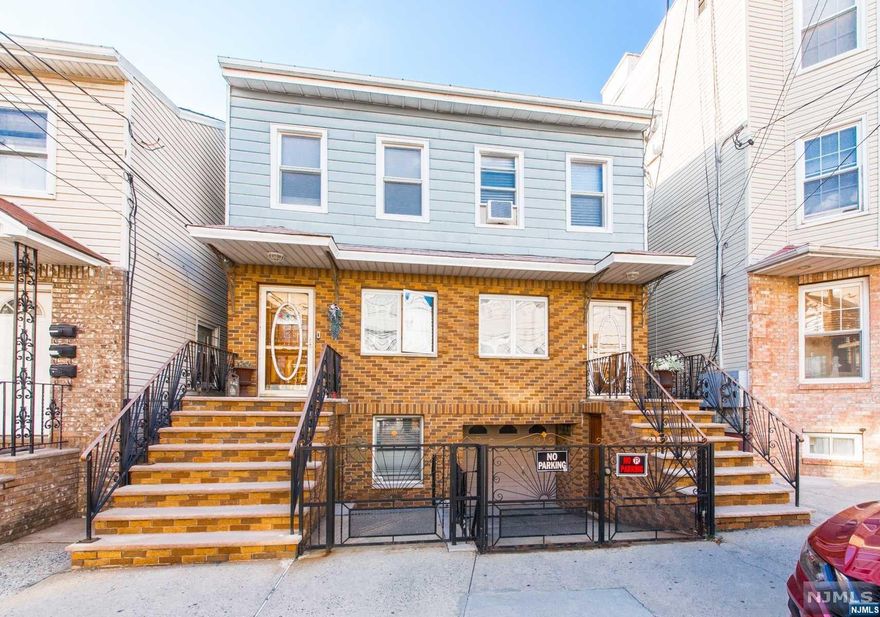 Three Family Town House Style Side by Side Home with ground level apartment. Located in the heart of the Ironbound, this home offers spacious rooms, plenty of closets, separate utilities, an attached garage with a driveway for one car. Close proximity to Newark Penn Station, house of worship, schools, fine dining, and shopping.