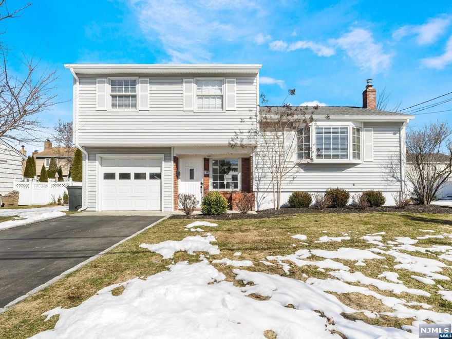 Beautifully renovated 3 bedroom 2 bathroom Split Level. Greet your guests into the ground level entry foyer. Entry foyer leads upstairs into the spacious living room. The living room leads into the dining room offering the perfect opportunity to savor a quiet meal at home or entertain your guests for any holiday. Sliding glass doors lead out the spacious backyard. The dining room leads into the tastefully renovated kitchen featuring center island, custom cabinetry, ss appliances and quartz countertops. A home cook's dream kitchen! Retreat upstairs to find the primary bedroom with built-in extra closets. Two add'l bedrooms and full bathroom equipped with tub shower and dual sink storage vanity complete the 2nd floor. Through the foyer, the ground level offers full bathroom complete with glass enclosure stall shower, laundry room and entrance to 1-car attached garage. Finished basement offers family room, storage and utilities. New windows, hardwood. Roof replaced 2021.