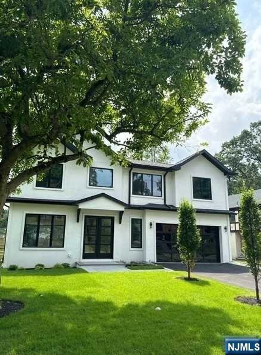 LOCATED IN THE EAST HILL (SMITH SCHOOL SECTION). BRAND NEW CONSTRUCTION WITH BRAND NEW FOUNDATION IN THE SOUGHT OUT EAST HILL SECTION OF TENAFLY. APPROXIMATELY 4500 FT. OF FINISHED LIVING SPACE. FIRST FLOOR IS COMPRISED OF POWDER, ROOM, DINING ROOM, FAMILY ROOM AND A BEAUTIFUL MODERN KITCHEN. SECOND FLOOR HAS MASTER SUITE WITH HIS AND HERS WALK IN CLOSETS / AMAZING SHOWER WITH BENCH, SOAKING TUB AND DOUBLE VANITIES, ONE EN SUITE AND TWO BEDROOMS WITH JACK AND JILL BATH, LAUNDRY. FULLY FINISHED BASEMENT WITH RECREATION ROOM, FULL BATH, BEDROOM, GYM, OR HOME THEATER. HIGH END KITCHEN APPLIANCE. WHITE OAK FLOORING. WHOLE HOUSE GENERATOR. TO COMPLETED SUMMER 2024.