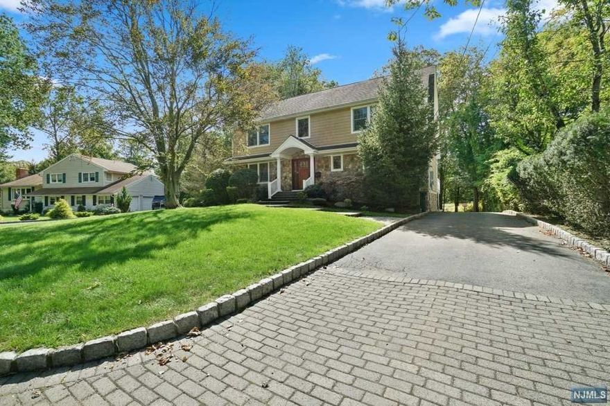 Situated on the 10th Green of Ramsey Golf & Country Club this immaculate 5 bed/3.5 bath Stone front Colonial Home boasts an Open Concept layout, gleaming hardwood floors & complete privacy! Take advantage of all the amenities the club has to offer; Pool, Beach, Kayaking, Tennis, Golf & 2 Restaurants. 1st level offers a front to back Great Room w/ Gas FPL, oversized windows, Formal Dinning Room & Gourmet Kitchen w/ Sliders to large deck & views to Golf Course. Upstairs you will find a large Master Suite/Master Bath & WIC. 3 Additional spacious bedrooms (one being Home Office), Full Hall Bath, Open Staircase to fully finished Attic (Home Office #2) with Crown Molding throughout! Huge Driveway, Wrap-around 2 Car-Garage, Grade Level basement w/ Living Area, Bedroom, Full Bath! Walk outside to your Paver Patio (room for Hot Tub) & enjoy the yard. Minutes to 2 Train Stations or bus to NYC, Shopping, Allendale Highly Rated Schools & Fine Dinning! TRULY a MUST SEE! *see docs for HOA/Fees*