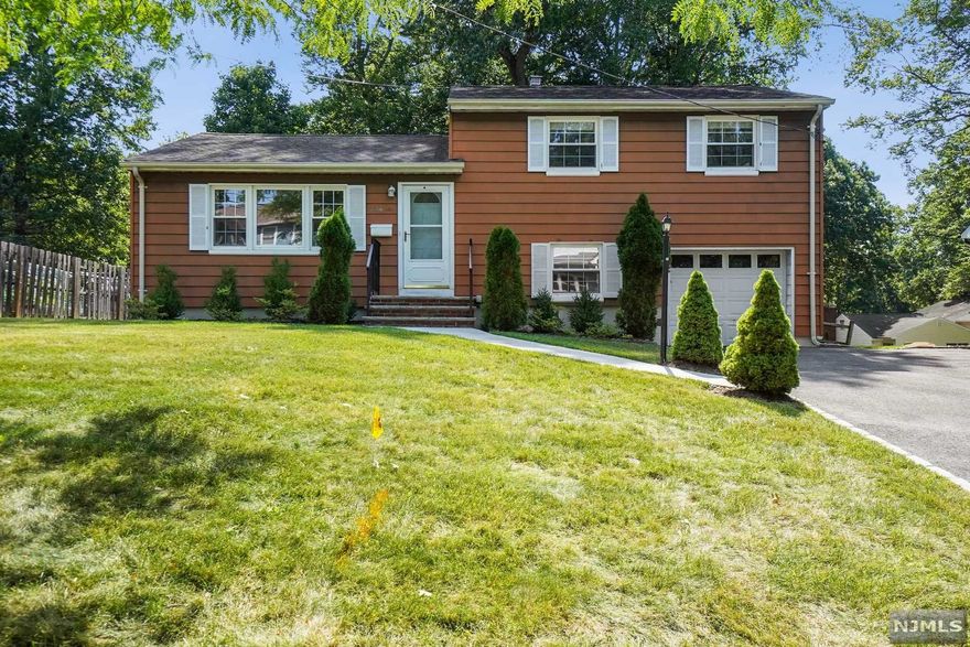 Welcome home to this spacious 3 bedroom, 2 1/2 bath split level house with picturesque curb appeal in the very desirable Riker Hill section of town. Inviting living room, formal dining room and eat-in kitchen on the first floor. All three bedrooms located on the second floor--master bedroom suite as well as two bedrooms with hallway bathroom. The ground level includes the family room, garage access, utilities laundry room, powder room and access to park-like backyard for outdoor enjoyment. Center air (2021), water heater (2021) & water softener (2022). Close proximity to Town Center, Town Pool, Top-Rated Schools, plus easy commute to NYC.