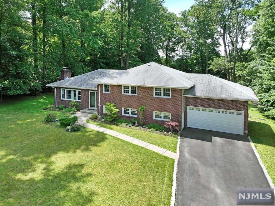 Have you been waiting patiently for a Large home in Upper Saddle River to make your own? This home is Next to the Upper Saddle Schools, close to Parks & located on a QUIET street. Only a 3 mile drive to the FREE Park & Ride EXPRESS BUS to NY Port Authority. WEGMANS & Whole Foods are less than 3.5 miles away. Serene Country living at it's finest, yet minutes to EASY SHOPPING, highways & Transportation. A bucolic community located less than 30 miles from midtown NYC offering privacy & space. Surrounded by homes of much higher value, this entry level home offers lots of room and expansion possibilities too! Hardwood floors in the Living Room, Dining Room & the spacious bedrooms. The Family room is HUGE and could easily be converted for extended family. Low taxes & Top Notch Schools make Upper Saddle River a highly sought after suburban community.