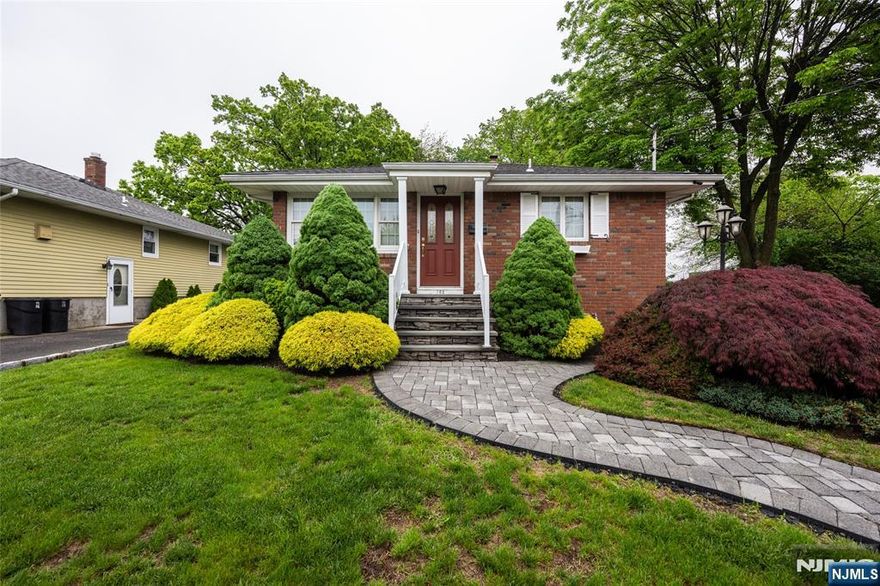 Beautifully landscaped home in desirable Totowa, featuring a paver walkway and driveway. Inside, you'll find a spacious living room, a custom kitchen with all appliances, two bedrooms with the potential for a third, and a large great room at the rear of the home. The finished basement offers a charming brick wood-burning fireplace. Additional highlights include central air conditioning, a storage shed, and more. Conveniently located close to everything you could ask for, shopping, dining, parks, and top-rated schools with easy access to mass transit and major highways for a smooth commute.