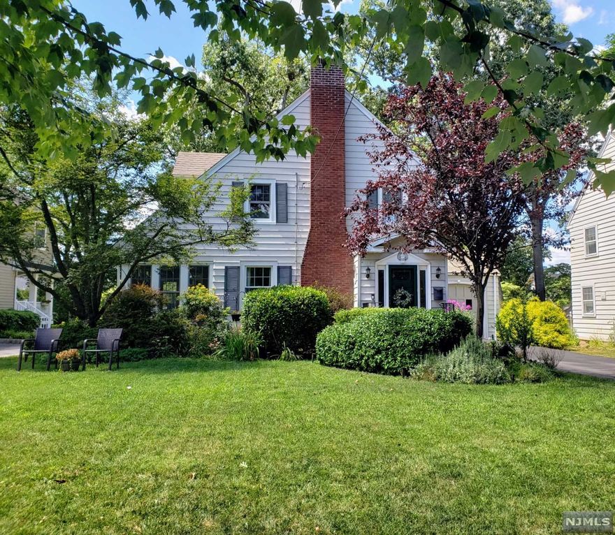 Welcome to this warm and inviting four bedroom Colonial located on one of Glen Rock's most charming streets in a sought after prime location! The entry welcomes you to the large living room with a wood-burning fireplace and a beautiful all season enclosed sun porch. Continue through the archway to find the formal dining room with a view of the patio and lush backyard. Next, enter the eat in kitchen that boasts new quartz countertops and a cozy breakfast nook. The first floor is complete with a half bath. On the second level of this lovely home there are 4 bedrooms and a renovated full bath with marble tile. The master bedroom is complete with double closets and an alcove. The second level gives you full attic access with tons of storage space. The finished lower level offers a terrific modern primary room with luxury vinyl plank, exposed ceilings, laundry/half bath and plenty of storage. This home has newer windows, in ground sprinkler and too many other features to list!