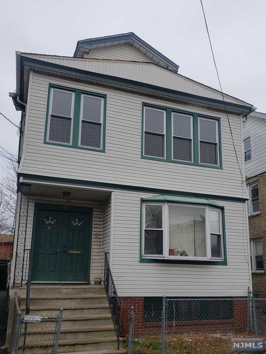MOVE IN READY.....Beautifully maintained 2 family home. This property boasts 2 spacious units with large living & dining quarters attached to a cozy sunroom/den. The 2nd flr kitchen is equipped with gas and water line for washer/dryer. Finished basement with family room and wetbar.