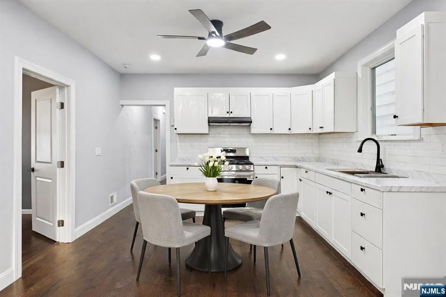 Where everything is new and nothing has been compromised. This beautifully reimagined four-bedroom residence has just completed a full, top-to-bottom renovation and has never been lived in post renovation, offering the rare opportunity to be the very first occupant of a truly fresh space. The layout is both generous and functional, featuring four spacious bedrooms, one full bathroom plus a half bath, and a separate den. Perfect for a home office, study, or flex living space. Clean lines, modern finishes, and thoughtful design details create a bright, comfortable atmosphere that feels calm, current, and move-in ready. Convenience is built into daily life here. One dedicated parking spot is included, public transportation and bus routes are just moments away, and a laundromat is directly across the street. The location offers easy access to shopping, dining, and everyday essentials. Set in Passaic, this apartment delivers the best of comfort, accessibility, and modern living ideal for those looking for space, freshness, and ease without compromise.