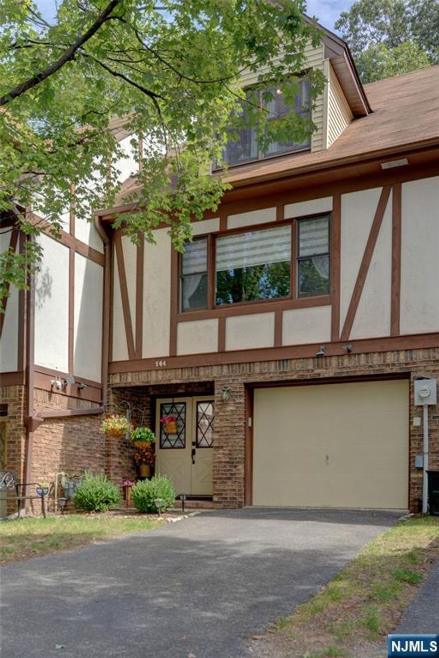 Completely renovated townhome in desirable Wayne! This 2-bedroom, 1.5 bath home is set in a private community of just 6 units and offers a bright, open layout. The first floor features a modern kitchen with a Calcutta quartz center island, stainless steel appliances, and a breakfast area that opens to a charming deck with privacy trees, as well as a spacious dining and living area and a half bath finished in marble floors. Upstairs, 2 generously sized bedrooms offer excellent closet space and a beautifully updated Jack-and-Jill bath with a newer vanity, a separate makeup area, and a convenient laundry chute. Gleaming hardwood floors run throughout the second and third levels. The ground level features a den currently set up as a gym, plus a laundry room. Additional highlights include a recently updated HVAC and hot water tank, a one-car garage with a driveway, and a full attic for extra storage. Ideally located in close proximity to the town pool, schools, shopping, and mass transit.