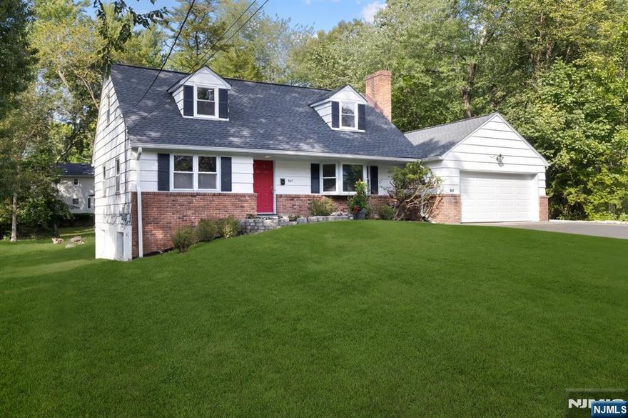 Large Cape Cod on a park-like property (approximately 2/3 of an acre) in the very desirable Village of Ridgewood. Home provides the advantages of Ridgewood public schools, easy commute into NYC (via nearby express bus or train) and the vibrant Ridgewood downtown with a range of restaurants and stores. Home features four bedrooms, two full baths, 2-car garage (w/ new garage door and opener), large deck, screened-in porch/mud room, large (unfinished) basement, and kitchen renovated with new refrigerator, dishwater, and countertop. This house is larger than it seems and is (if you choose) great value for its potential expansion. Fireplace is "as-is" no known problems. (When visiting, Extra Parking across the street on Gateway Rd.)