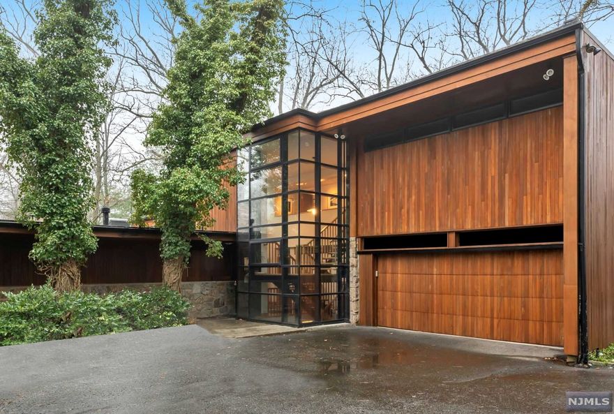 Picturesque & Perfect! This unique Charles Patton designed home is nestled on 1.46 wooded acres on the East Hill. With abundant views & privacy, this well maintained residence is a RARE find. The many windows & skylights are perfect for those seeking to welcome nature into their home. The floor-plan is spacious & features the primary suite with a private terrace on the main floor, 3 additional bedrooms on the second floor with the possibility of converting 2 additional rooms to bedrooms OR leave as existing Den & Office. The kitchen includes high-end luxury appliances with an oversized sitting/breakfast area. Perfect for entertaining, the Great Room and Dining Room exude amazing views with wrap-around sliding windows to the covered porch. The lower level walk-out Family Room is the perfect escape to the property. Screened porch, terraces, connecting terraces, covered wrap-around outdoor living space plus a beautiful gunite pool offers ample opportunities to enjoy the outdoors.