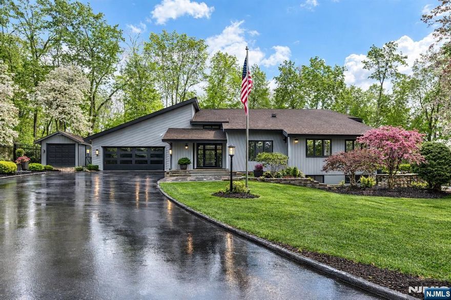 Perfectly positioned on a private cul-de-sac in Saddle River, this extensively renovated contemporary offers the rare luxury of true one-floor living set on two private acres surrounded by mature trees. Inside, soaring ceilings and refined finishes frame a stunning chefâ€™s kitchen with Viking and Sub-Zero appliances, custom cabinetry, dramatic waterfall island, stone counters and heated floors. The open dining and living spaces with a striking stone fireplace flow seamlessly to one of the outdoor entertaining areas. The first-floor primary suite provides a private retreat with sitting area or office, custom closets, and a new spa bath featuring soaking tub, Sauna, heated floors, dual vanity and custom walk-in shower. Upstairs offers three spacious bedrooms, two newly renovated baths with heated floors, and a bonus room created from a finished attic. Outdoor living rivals a private resort with multiple pergola-covered seating areas, a large deck with firepit, custom pool with electric cover, expansive patio, and covered cabana lounge all surrounded by beautifully landscaped grounds. The finished lower level includes recreation space, wine room, cedar closet and custom storage. Additional improvements include new windows, doors, moldings, flooring, updated systems, water softener, radon mitigation, and pool mechanicals. A turnkey Saddle River retreat combining privacy, design and exceptional indoor and outdoor living.