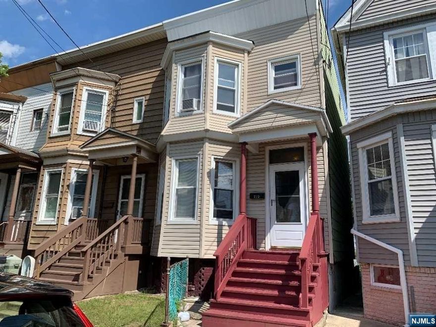 Handyman's special! End-unit row house in need of TLC and updating. Vinyl tiled floors throughout. Thermal windows about 15 years old. Ceiling light with fan in dining room. Close to public transportation, shopping and schools. Being sold AS IS. Buyer is responsible for C.O. required repairs.