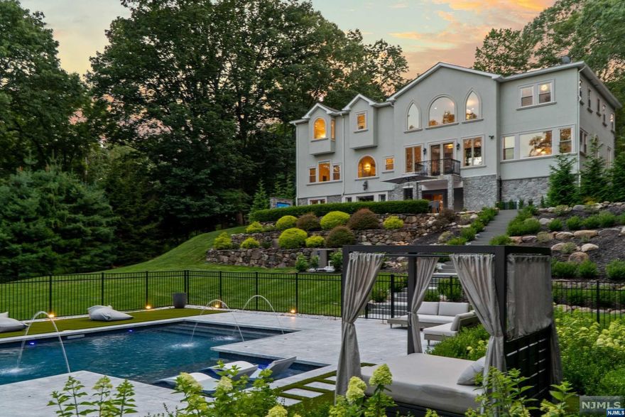 Nestled in the tranquil and esteemed neighborhood of USR, 68 Hillcrest Drive stands as a paragon of luxury & renovated in 2020 to 2023. This single-family home has been meticulously transformed through a comprehensive overhaul, resulting in a residence that is the pinnacle of sophistication & comfort. Perched above the hillside, the unique landscape of this home provides dramatic mountain views from almost every room. An entertainer's dream, the transformation extends beyond its interior, with the outdoor space metamorphosed into a private sanctuary. The backyard offers a serene retreat from the world. Beautifully landscaped gardens frame a spacious marble patio area leading to a stunning saltwater pool that glistens under the sun. Every detail, from the high-end fixtures to the premium finishes, has been thoughtfully selected to create a living space that is both opulent and inviting. Top-rated schools make this a premiere location for those balancing family, work, and leisure.