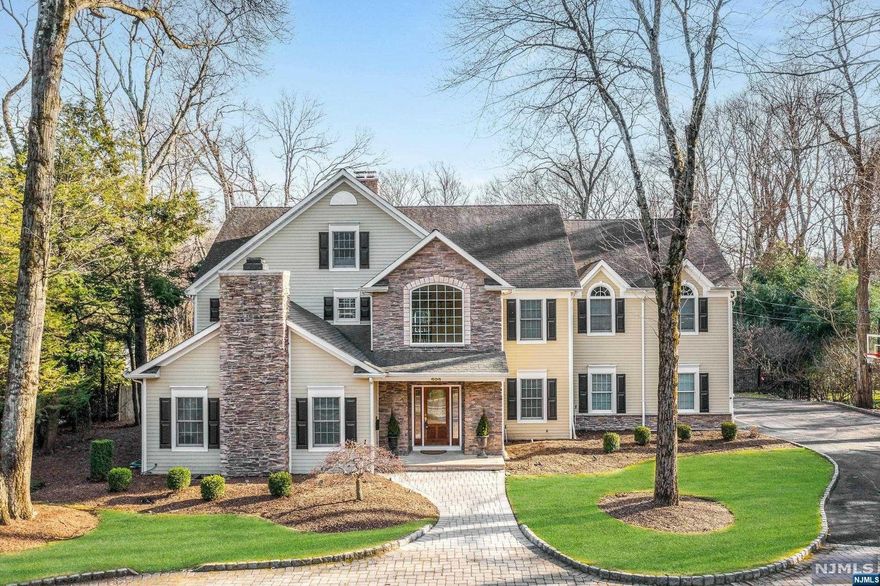 BACK ON MARKET! Presenting a colonial manor in Wyckoff's desirable Hartung section. This distinguished home features a grand entry foyer, living room, and two-story great room, both with fireplaces. A first-floor bedroom with full bath adds versatility. A large dining room, office, and sunroom complete the main floor. The second floor boasts four bedrooms, including a primary suite with two walk-in closets, a fireplace, and a lavish bath. The recently renovated white kitchen is a culinary delight, equipped with Subzero fridge, Wolf appliances, ice maker, and a stylish island with a beverage fridge. Outside, the nearly one-acre lot showcases a circular paver driveway leading to a 3-car attached garage. The backyard oasis includes a large heated gunite pool accompanied by a spilling hot tub and a spacious composite deck for outdoor entertainment. To schedule a showing or if you have any questions please contact Jeff Feagles at 201-803-9624.