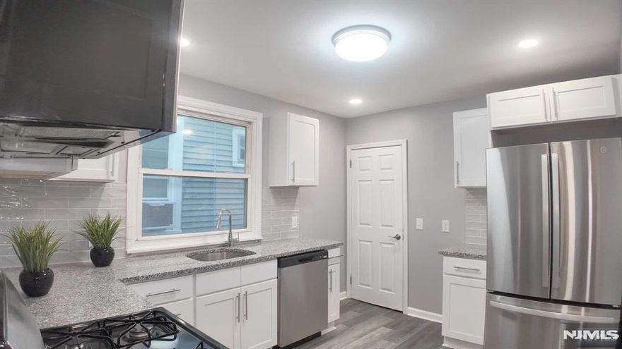 Welcome to your fully renovated, move-in-ready dream apartment! Private parking, extra storage and washer/dryer available! This stunning 1st-floor unit combines modern luxury w/ everyday convenience, featuring 2 spacious bedrooms, 1 beautifully updated bathroom, and an additional bonus room perfect for a home office, cozy den, or creative studio. Step into the heart of the home the brand-new, modern kitchen. You'll love the sleek all-white cabinetry, sparkling new countertops, and stainless steel appliances that elevate the space. A large walk-in pantry adds exceptional storage, while the open, airy layout invites both casual dining and elegant entertaining. The entire apartment radiates warmth and brightness with new flooring and lighting creating a fresh inviting atmosphere in every room. Location is everything and this apartment delivers. Situated just a few blocks from two major transportation options - NJ Transit 30min direct to NYC(Penn) from Watsessing Stop & NJ Train Grov