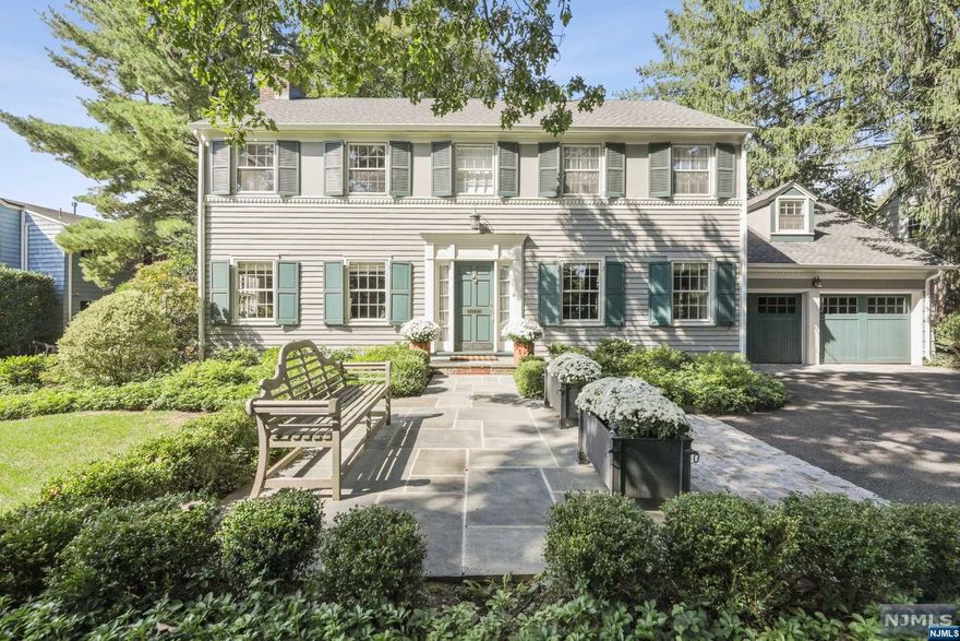 An original Stewart Hartshorn stone wall welcomes you to this Custom Colonial in a prime Short Hills location across the street from the idyllic 28-acre Greenwood Gardens in the sought after Deerfield section. Situated on stunning, level park-like property, this meticulously updated home boasts designer finishes everywhere and terrific flow. Foyer flanked by formal Living and Dining Rooms sets the tone for this chic home. Living Room leads to a cozy Family Room with 3 walls of windows and views of the magnificent rear private grounds + direct access to patio. Chef's Kitchen with granite counters, SubZero refrigerator and floor to ceiling storage + access to yard and garage via Mudroom. Powder Room completes 1st floor. Open staircase leads to 2nd level with 3 Bedrooms + Bonus potential 4th Bedroom/office with vaulted ceiling. Primary Suite with hardwood floors, walk-in closet and luxe Bathroom. 2 more bedrooms on this level + 2nd Full Bath. Lower Level Rec Room and Laundry Area.