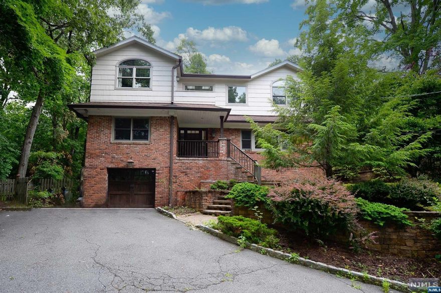 FRAMED BY MATURE TREES AND LUSH LANDSCAPING, THIS CLASSIC CONTEMPORARY HOME HAS WOW FACTOR THAT YOU ARE LOOKING FOR IN YOUR NEXT HOME! YOU WILL APPRECIATE THE PERFECTLY PLANNED FLOW OF THIS HOME WITH ITS BANQUET-SIZED DINING ROOM THAT OPENS UP TO A FAMILY ROOM/DEN/OFFICE OVERLOOKING THE WALK OUT PATIO, PERFECTLY MANICURED LAWN, A TRUE CHEF'S DREAM WITH ITS GOURMET CHEF'S KITCHEN THAT BOASTS KEMPER CABINETRY, GRANITE, AND JERUSALEM LIMESTONE COUNTERS AND A CENTER ISLAND AN ADJOINING BREAKFAST ROOM PERFECT TO SHOWCASE ALL THE JAW DROPPING MEALS THAT YOU WILL BE MAKING OR YOU CAN SHOW US YOUR POKER FACE AND USE THIS SPACE AS A GAME ROOM, THE FIRE PLACE IN THE GREAT ROOM IS PERFECT TO SNUGGLE UP NEXT TO FOR THE UPCOMING COOLER MONTHS. VAULTED CEILINGS AND EXPOSED BEAMS ENHANCE THE SECOND LEVEL, WITH ITS MASSIVE PRIMARY BEDROOM SUITE WITH A SITTING AREA, WALK-IN CLOSET, AND SPA LIKE PRIMARY BATHROOM. THIS HOME HAS SO MUCH TO OFFER, SO DON'T WAIT TO MAKE THIS DREAM HOME YOURS.