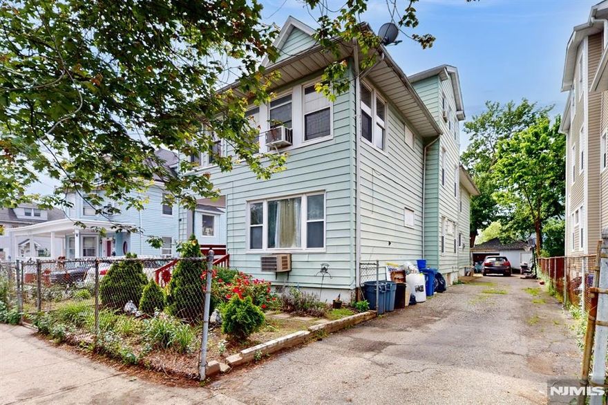 Welcome to this oversized 2 family in the East Side section of Paterson NJ. This home features 3 huge bedrooms with dining and living room in the first floor and 4 bedrooms with similar layout in the second. It has a finished attic and basement with a long driveway and 2 car garage. This multifamily property is perfect for first time buyers or someone looking to add to their real estate portfolio. Set your showing today!