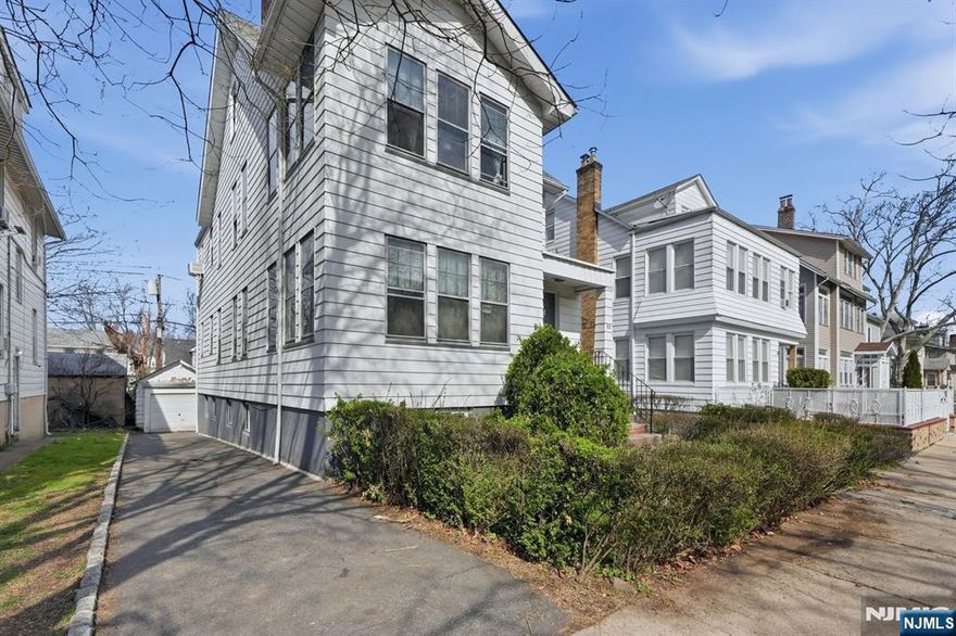 Calling all investors! Don't miss this fantastic opportunity to own an income-producing property with value-add potential. The first and second floors each feature 2 bedrooms, 1 bathroom, a formal living room, dining room, and an enclosed porch offering additional potential uses. The property also includes a finished attic with a full walkout, as well as a full basement with high ceilings and a walkout, currently unfinished and ready for your vision. A driveway and detached garage provide added convenience. Being sold as-is. All units are vacant except for the first floor, which will be delivered with a tenant in place. Conveniently located close to transportation and schools.