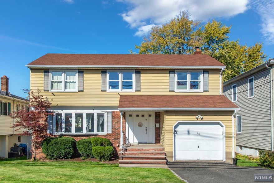WELCOME TO THIS STUNNING HOME IN PRESTIGIOUS & HIGHLY SOUGHT AFTER ALLWOOD SECTION OF CLIFTON! This beautiful colonial sits on a level lot riddled with light. The open concept when you enter features the kitchen w/ stainless steel appliances, and oversized living room & formal dining room with freshly refinished HDWD floors. Updated powder room & first floor laundry leading to the BONUS family room/den with sliders opening to the deck & back yard. Upstairs features 4 spacious bedrooms including master w/ en-suite & walk-in closet. Fully finished basement w/ home office, and tons of storage space! Not to mention, WALKING DISTANCE to NYC bus makes this a perfect home for commuters or stay at home workers. Also just minutes from major highways including GSP, grocery stores, parks, houses of worship, and downtown Montclair. Do not miss this home! Its waiting for you to put your own touch!