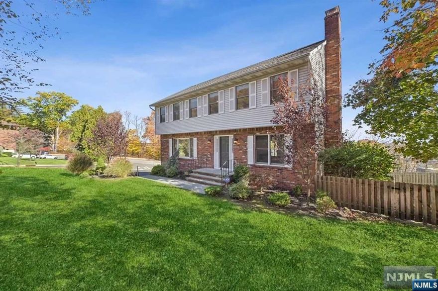 The stunning partial brick colonial, situated on a nice and desirable street in town. This meticulously and lovingly cared 4 Bedrooms and 2.5 Baths home featuring welcoming entrance open up to entrance foyer. The main level offering a living room, a family room with wood-burning fire place, a formal dining room, a powder room, a laundry room and a gourmet eat-in kitchen leads to a charming outdoor deck with beautiful NYC VIEWS. A staircase leads to the 2nd level offering a primary bedroom with primary bath, 3 additional bedrooms and a full bath. The unfinished lower level has plenty of storage space. Additionally featuring 2 Car attached Garage with expanded ample drive way and in-ground swimming pool. Monthly HOA fees to be applied as part of the Highview at Hawthorne Association for use of tennis courts, street plowing and salting, and weekly private garbage pickup.